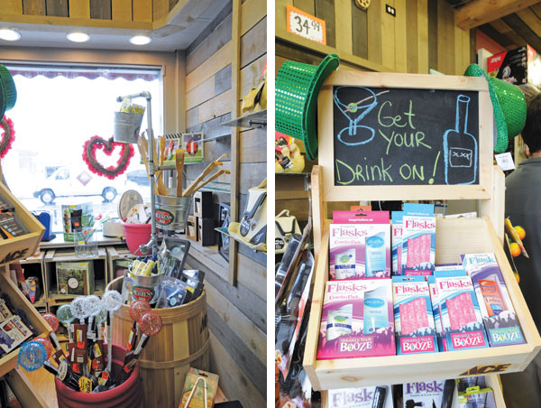 Instead of a standard dump bin, a wooden barrel perfectly complements the wood slats on the wall, while a hanging rack made of galvanized pipe holds buckets or small items like backscratchers and hand lotion.