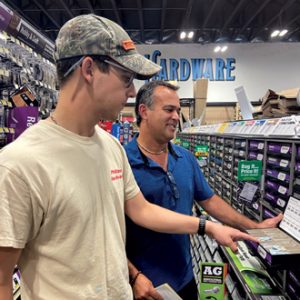 An employee helping a customer in a hardware store