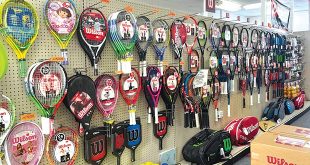 Store Services - a wall display of tennis rackets
