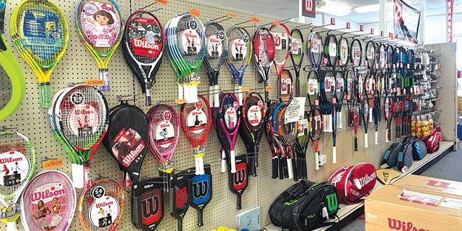 Store Services - a wall display of tennis rackets